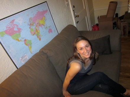 Me and a small glimpse of my apartment (plus the map of the world my boyfriend so graciously purchased for me at christmas time and framed for me 5 months later for my birthday because I am that lazy.)